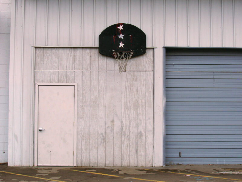 Rustic photo with backetball hoop with 3 stars on it